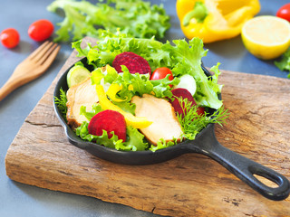 Chicken and vegetable salad in a mini pan for healthy eating or low-fat food concept.