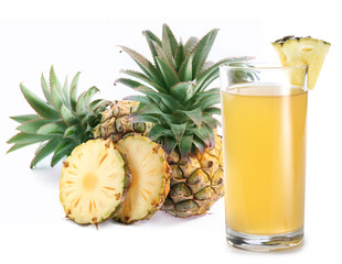 Glass of pineapple juice and group of pineapple fruits at the background. Studio shot isolated on white background.