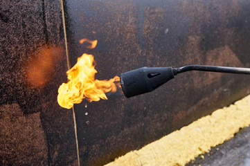 propane blowtorch close up during construction works