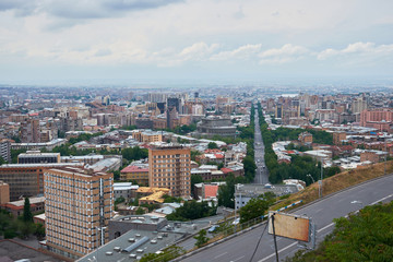 view of the city of Yerevan from the observation deck on a sunny day with clouds in the sky.