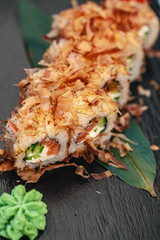 Japanese food restaurant, sushi and rolls on dark background