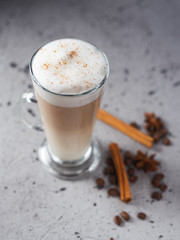 Coffee latte in a glass on a concrete table