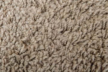 Texture of wool carpet close-up