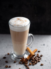Coffee latte in a glass on a concrete table