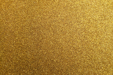 Texture of golden colored foamiran sheet with sparkles
