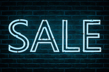 3d illustration: Advertising neon sign with the inscription "sale" of blue letters on the background of a red brick wall. 