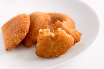 Rissole in French, as risole in Brazil, or rissol in Portugal, is a salty pastry, a kind of half-moon shaped snack, it can be meat, shrimp or cheese.