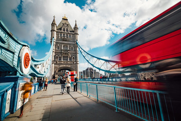 Fototapeta na wymiar Motion blurred pedestrians and traffic at Tower Bridge in London