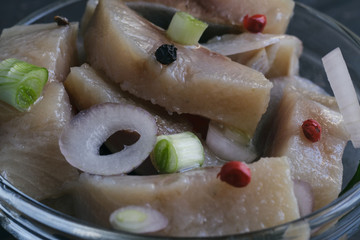 Scandinavian food herring with onion and brown bread
