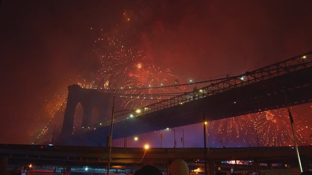 Crowd at Brooklyn Bridge watching fireworks