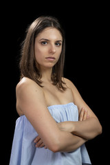 Fototapeta premium Portrait of a strong determined girl on a black background