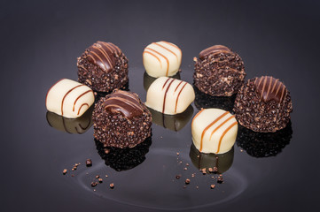 Chocolate candies and pralines Assortment of dark white and milk chocolate