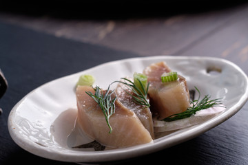 Scandinavian food herring with onion and brown bread