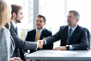 Business people shaking hands, finishing up a meeting. Handshake. Business concept.