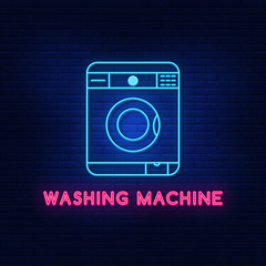 Neon lighting of the washing machine. Bright machine gun. Modern vector logo, icon, banner, shield, screen, washing machine image. Night advertising on the background of a brick wall.