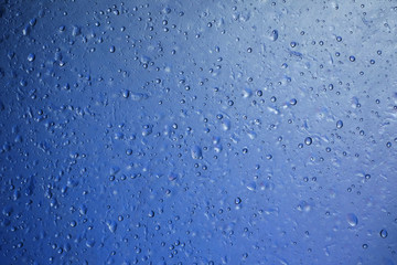 water drop on blue plastic texture