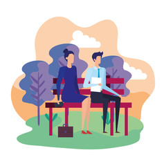elegant business couple seated in the park chair