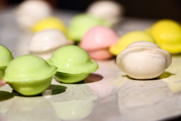 small colored dumplings on white background. food for children, festive and Christmas parties.