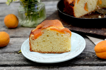 Cake with apricots on a table in the garden