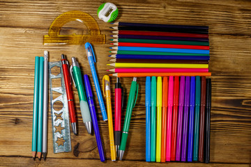 Set of school stationery supplies on a wooden desk. Back to school concept