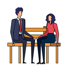 elegant business couple seated in the park chair