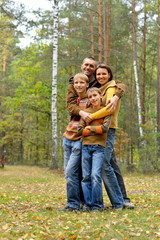 Fototapeta premium Portrait of family of four in park