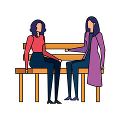 elegant businesswomen seated in the park chair