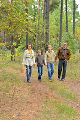 Fototapeta premium Portrait of family of four in park