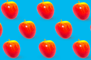 Pattern with red apple on blue background