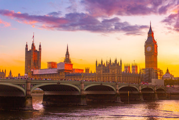London Parliament big ban tower at sunset with bridge and Thames river
