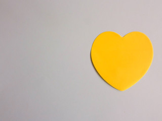 yellow heart on a dark white background. element for design. love concept