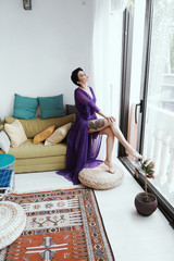 female with short haircut poses in Tbilisi loft