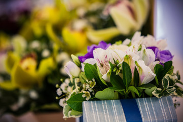 Colorful flower bouquets on desk as a gift