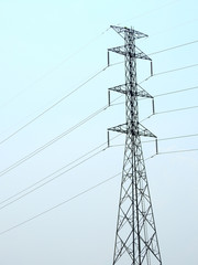 silhouette high voltage pole with blue sky background