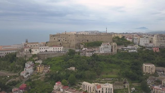Aerial view of the Castle of Sant'Elmo in Naples. Flight of the drone over the castle overlooking the bay and city blocks.