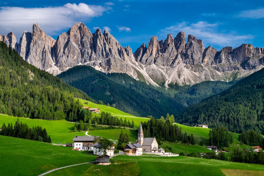 The St Magdalena Church with the Odle mountain range towering above it, Funes Valley, Dolomites, Italy.