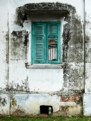 blue wood window close on dirty wall with mold