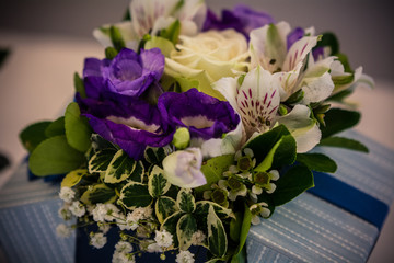 Colorful flower bouquets on desk as a gift