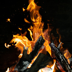 fire flames in bonfire stove isolated with balck