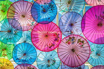 Fototapeta na wymiar Decoration on wall by colorful umbrellas