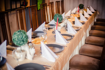 Fancy green dinner table in a reastaurant