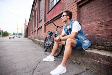 portrait of a trendy young man in the city.