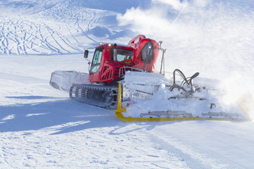 Snowplow clears tracks in the ski resort of the Hintertuxer in Tyrol, Austria