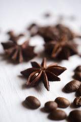 Close-up star anise and coffee beans on a white background