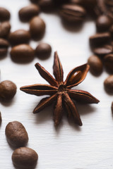 Close-up star anise and coffee beans on a white background