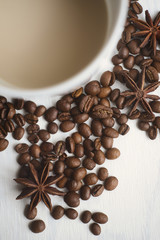 Coffee cup and coffee beans on a white background