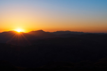 Fototapeta premium Beautiful landscape, golden sunset over the mountains. View from Nemrut Mountain, Turkey.