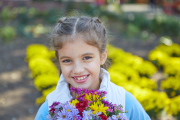 Beautiful happy girl in autumn park