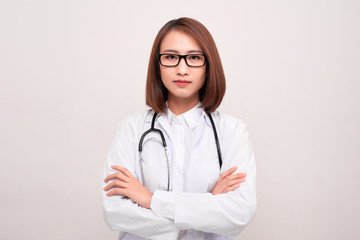 Fototapeta premium Cheerful happy doctor with crossed hands on white background