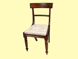 wooden chair isolated on off white and pink background